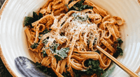 A mouth-watering fettuccini pasta with kale and romesco sauce