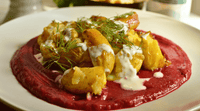 Smashed Potatoes Served With Beetroot Chickpea Puree