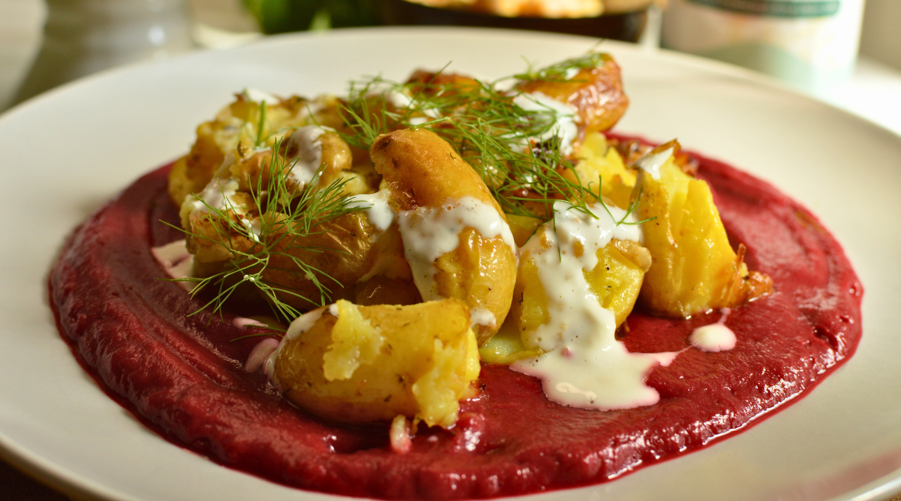 Smashed Potatoes Served With Beetroot Chickpea Puree